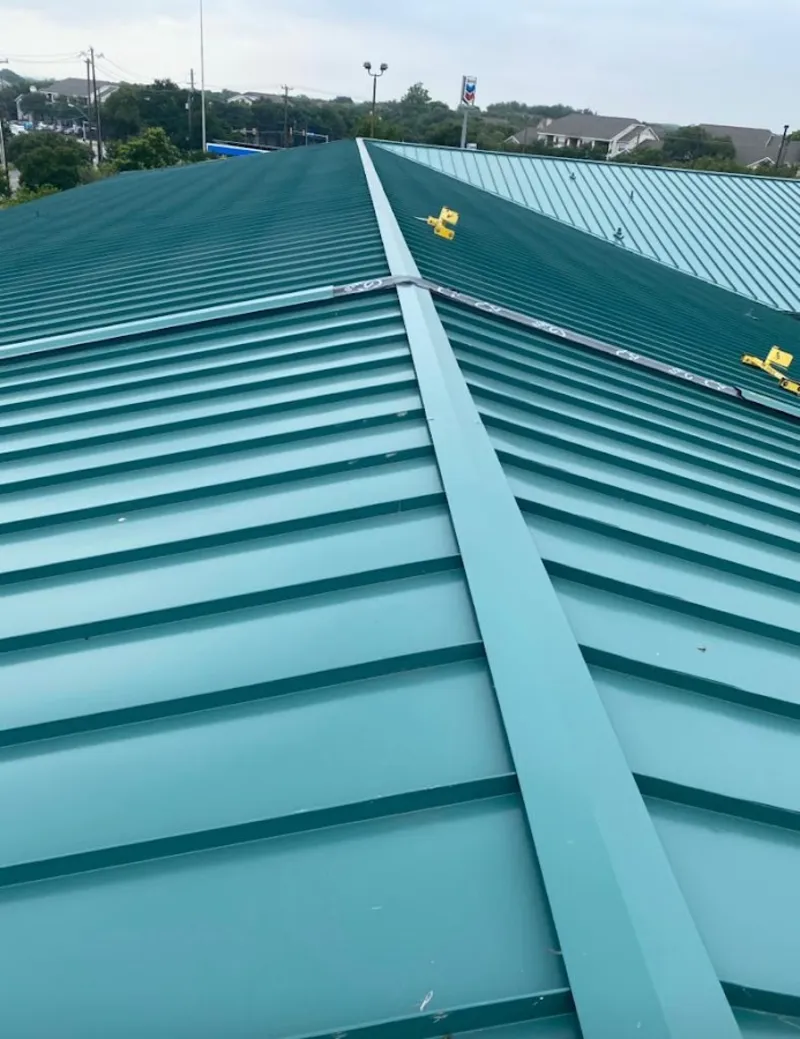 Green commercial metal roof ridge and valley for Metal Roof Repair in New River